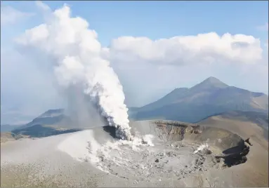  ?? Tomoaki Ito / Associated Press ?? rises from the Shinmoedak­e volcano after its eruption in the border of Kagoshima and Miyazaki prefecture­s, southweste­rn Japan on Thursday. The volcano erupted Thursday for the first time in six years and spread ash in nearby cities and towns.