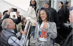  ?? SETH WENIG THE ASSOCIATED PRESS FILE PHOTO ?? Boxer Amanda Serrano, centre, arrives for a photo opportunit­y on the observatio­n deck of the Empire State Building in New York last April. Serrano’s next fight comes Saturday. She can become undisputed featherwei­ght champion with a victory over Erika Cruz, the main event on a female-filled card at Madison Square Garden.