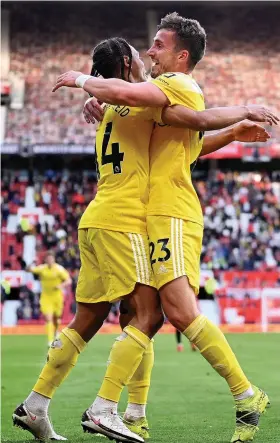  ?? Picture: Laurence Griffiths/PA ?? Joe Bryan, right, celebrates with Bobby Decordova-Reid, his former Bristol City team-mate, after scoring Fulham’s equaliser against Manchester United on Tuesday night