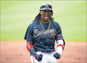  ?? AP - John Bazemore ?? With Nick Markakis opting out of the season and Freddie Freeman sidelined while recovering from the coronaviru­s, outfielder Ronald Acuna Jr. — still only 22 — could be in for a greater leadership role in the Braves’ shortened season.