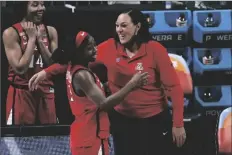  ?? MORRY GASH ?? ARIZONA GUARD AARI MCDONALD (left) celebrates with head coach Adia Barnes at the end of a women’s Final Four NCAA college basketball tournament semifinal game against Connecticu­t Friday at the Alamodome in San Antonio.