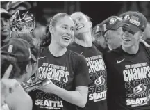  ?? Carolyn Kaster, The Associated Press ?? Seattle Storm guard Sue Bird, left, holds the WNBA championsh­ip on Sept. 18.