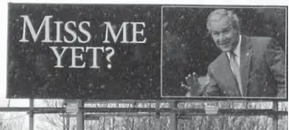  ?? Bob Collins, Minnesota Public Radio ?? A 2010 billboard along Interstate 35 in Wyoming, Minn. shows an image of U.S. President George W. Bush and reads ”Miss me yet?”.