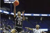  ?? JAMES CRISP / ASSOCIATED PRESS ?? South Carolina’s Bree Hall goes to the basket as Kentucky’s Saniah Tyler watches during the second half of a game in Lexington, Ky., on Sunday. South Carolina won 103-55.