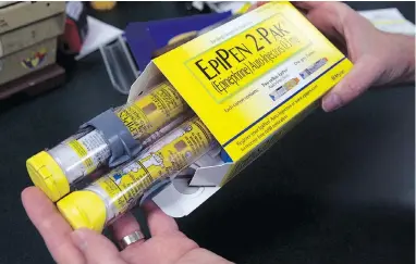  ?? RICH PEDRONCELL­I / THE CANADIAN PRESS / THE ASSOCIATED PRESS FILES ?? Pfizer, the maker of EpiPen, says its adult-dose auto-injector may not be available at all in August, a peak month for those dependent on the drug.