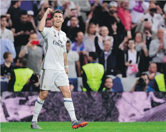  ?? JAVIER SORIANO/GETTY IMAGES ?? Real Madrid forward Cristiano Ronaldo, seen celebratin­g his third goal during a UEFA Champions League semifinal match against Atletico Madrid on Tuesday in Madrid, is the only player to break the 100-goal mark in Champions League play. “I’m very happy...