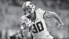  ?? [CRAIG MITCHELLDY­ER/ THE ASSOCIATED PRESS] ?? Oklahoma State's Chuba Hubbard had a calming influence with teammates last week before the season opener at Oregon State.