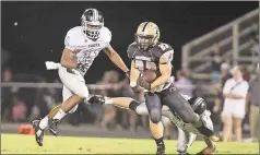  ?? Steven Eckhoff / Rome News-Tribune ?? Pepperell’s Hunter Chastain runs past Coosa’s M.J. Chubb during Friday’s game.