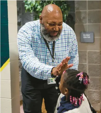  ?? MELISSA MELVIN-RODRIGUEZ/THE CHARLOTTE OBSERVER ?? Michael Hayes, a fifth grade language arts teacher at Hidden Valley Elementary School in North Carolina, started the program Men Count to bring a positive influence into the school.