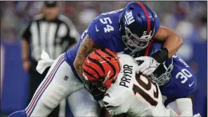  ?? (AP/Julia Nikhinson) ?? New York Giants linebacker Blake Martinez (top) tackles Cincinnati wide receiver Kendrick Pryor during the Giants’ 25-22 exhibition victory last month in East Rutherford, N.J. Martinez, who led the team in tackles in 2020, was released Thursday.