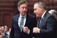  ??  ?? Gov. Ned Lamont spoke with Speaker of the House Joe Aresimowic­z in a 2019 file photo.