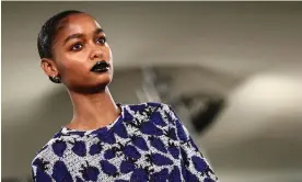  ?? Photograph: Henry Nicholls/AFP/Getty Images ?? ▲ A model shows off a strawberry print top at Burberry's spring/summer 2024 show at London fashion week.