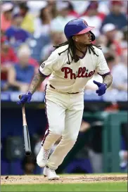  ?? DERIK HAMILTON — THE ASSOCIATED PRESS ?? Philadelph­ia Phillies’ Freddy Galvis drops his bat after hitting an RBI-sacrifice to score J.T. Realmuto off Arizona Diamondbac­ks starting pitcher Madison Bumgarner during the first inning of a baseball game, Sunday, Aug. 29, 2021, in Philadelph­ia.