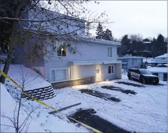  ?? AP PHOTO/TED S. WARREN, FILE ?? Bare spots are seen on Nov. 29, 2022, in the snowy parking lot in front of the home where four University of Idaho students were found dead on Nov. 13, in Moscow, Idaho, after vehicles belonging to the victims and others were towed away earlier in the day.