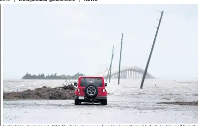  ?? AP ?? In this Friday, September 6, 2019, file photo, storm surge from Hurricane Dorian blocks Cedar Island off from the mainland on NC 12 in Atlantic Beach, N orth Carolina, after Hurricane Dorian passed the coast. A special United Nations-affiliated oceans and ice report released on Wednesday, September 24, projects three feet of rising seas by the end of the century, much fewer fish, weakening ocean currents, even less snow and ice, and nastier hurricanes, caused by climate change.