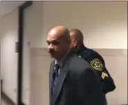  ?? CARL HESSLER JR. — DIGITAL FIRST MEDIA ?? Louis Henry Branch, 51, of Pottstown, is escorted from a Montgomery County courtroom after a jury convicted him of felony charges of rape of a child under 13.