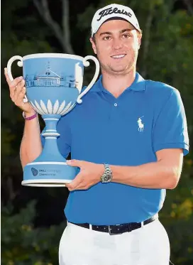  ?? — AFP ?? And this makes five: American Justin Thomas posing with the trophy after winning the Dell Championsh­ip at TPC Boston on Monday.