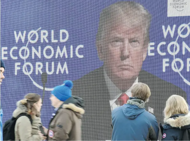  ?? MIGUEL MEDINA / AFP / GETTY IMAGES ?? Donald Trump spoke glowingly of the possibilit­ies for increased trade at the World Economic Forum Davos last week.
