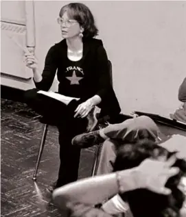  ?? HOLDEN FAMILY VIA THE NEW YORK TIMES. ?? Ms. Holden (above) photograph­ed teaching a class in 1979. And over 30 years later, (left) watched a rehearsal of a play exploring the 1964 free speech movement at UC Berkeley in Oakland, Calif., in 2014.