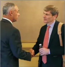  ?? THE ASSOCIATED PRESS FILE ?? Phillies majority owner John Middleton, right, seen with Commission­er Rob Manfred last year, may have expedited the Phillies’ rebuilding process by reassertin­g his urgency for the team to get better in a radio interview at midseason.