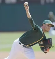  ?? AP) (Photo by Ben Margot, ?? Oakland Athletics pitcher Sonny Gray works against the Tampa Bay Rays on Wednesday.