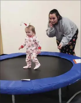  ?? SUBMITTED ?? Ashley Gumm, Early Childhood Education senior from Midview, has trampoline fun with a little PJ party guest.