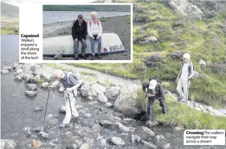  ??  ?? Capsized Walkers enjoyed a stroll along the shore of the loch Crossing The walkers navigate their way across a stream