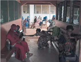  ?? ?? Pregnant women wait to be assisted at the Bundung Maternal and Child Health Hospital in Serrekunda, on the outskirts of Banjul, Gambia, in September. As health officials in Gambia and across Africa urge women to be vaccinated, they've confronted hesitancy among those of childbeari­ng age.