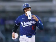  ?? HARRY HOW - GETTY IMAGES ?? Shohei Ohtani had his first two at-bats as a member of the Dodgers during Sunday night’s Freeway Series game against the Angels, his former team.