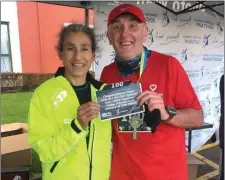  ??  ?? Tralee’s Conor Cusack (right) pictured with his friend, Lucy D’Arcy, after he completed his 100th marathon in Clonakity at the weekend.