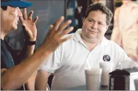  ?? Todd Yates Corpus Christi Caller-Times ?? REP. BLAKE FARENTHOLD (R-Texas) talks with a Corpus Christi business owner in August. “Most of the messages I’m getting from Texas are, ‘Hang on, you’re doing the right thing,’ ” Farenthold said of the government shutdown.