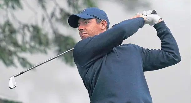  ??  ?? GROWING ACCUSTOMED: Rory McIlroy hits from the third tee during practice for the PGA Championsh­ip golf tournament at TPC Harding Park in San Francisco