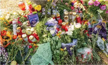  ?? Photograph: Peter Kneffel/dpa ?? Flowers, candles and pictures in Ingolstadt near where Khadidja O’s body was discovered in August 2022.