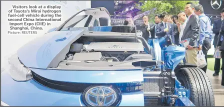  ?? Picture: REUTERS ?? Visitors look at a display of Toyota’s Mirai hydrogen fuel-cell vehicle during the second China Internatio­nal Import Expo (CIIE) in Shanghai, China.