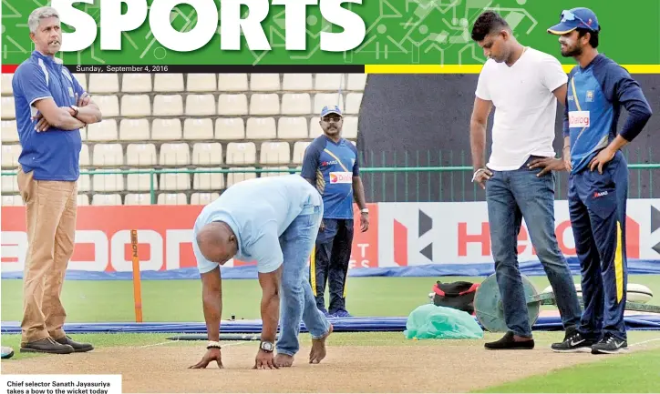  ??  ?? Chief selector Sanath Jayasuriya takes a bow to the wicket today while other selectors Ranjith Madurusing­he, Eric Upashantha along with skipper Dinesh Chandimal look on.
Pix by Amila Gamage