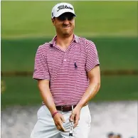  ?? KEVIN C. COX / GETTY IMAGES ?? Co-leader Justin Thomas reacts after a putt at the eighth hole en route to a 4-under 66 in the second round of the Tour Championsh­ip at East Lake Golf Club.