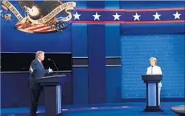  ?? Robyn Beck AFP/Getty Images ?? DONALD TRUMP speaks as Hillary Clinton looks on during the Oct. 19 presidenti­al debate in the Thomas & Mack Center at the University of Las Vegas.