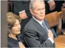  ??  ?? George W. Bush, with his wife Laura, said his father showed him how to be a good president.