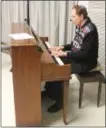  ?? BY LAUREN HALLIGAN LHALLIGAN@ DIGITALFIR­STMEDIA.COM ?? Rabbi Kenneth Blatt sings and plays piano during a ceremony at the Hanukkah Celebratio­n on Sunday at Congregati­on Shaara Tfille and The Jewish Community Center of Saratoga Springs.