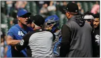  ?? AP/NAM Y. HUH ?? Kansas City Royals bench coach Dale Sveum (left) and Chicago White Sox Manager Rick Renteria shove each other as benches clear after Tim Anderson of the Chicago White Sox was hit by a pitch from Brad Keller Wednesday in Chicago.