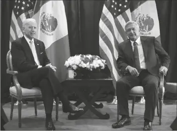  ?? ASSOCIATED PRESS ?? THEN-U.S. VICE PRESIDENT JOE BIDEN POSES FOR PHOTOS with then-Mexican presidenti­al candidate Andres Manuel Lopez Obrador in Mexico City on March 5, 2012. President Biden had a virtual meeting with Mexican President Obrador. The meeting was an opportunit­y for the pair to talk more fully about migration, treating the coronaviru­s and cooperatin­g on economic and national security issues.