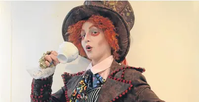  ?? Pictures: Kim Cessford. ?? Hannah Simpson, as the Mad Hatter, enjoys a cup of tea.