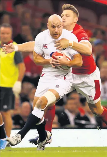  ??  ?? Willi Heinz is tackled by Dan Biggar during England’s defeat in Cardiff