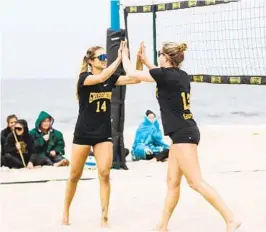  ?? COURTESY OF GROSSMONT COLLEGE ?? Alana Embry (left) and Madison Bogle did not lose a match on the way to 3C2A Beach Volleyball Pairs Championsh­ip, also leading Grossmont to the team title.