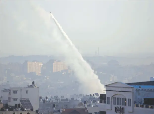  ?? (Mohammed Salem/Reuters) ?? A ROCKET fired from Gaza by the Palestinia­n Islamic Jihad heads toward Israel this week.