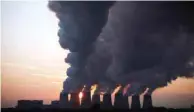  ?? Reuters — ?? Steam billows from the cooling towers of Jaenschwal­de coal power station near Cottbus, Germany.