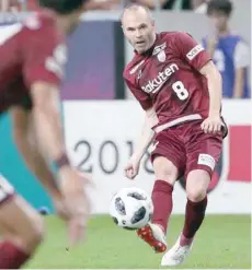  ?? — AFP ?? J-league club Vissel Kobe’s new signing, Spanish player Andres Iniesta (R), in action against Shonan Bellmare at Noevir Stadium in Kobe, Japan.