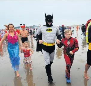  ??  ?? Brave the weather for this year’s Porthcawl Christmas Day Swim – the 55th one