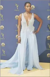  ?? Allen J. Schaben Los Angeles Times ?? ISSA RAE is a standout in a custom pale-blue silk V-neck Vera Wang jumpsuit with a split-away skirt.