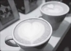  ??  ?? Cups of cappuccino sit on a table during the World Coffee Conference in Guatemala City on Feb. 26, 2010.